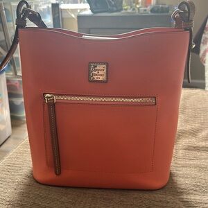 This is Dooney & Bourke New purse….color doesnt match my shoes i bought it for.